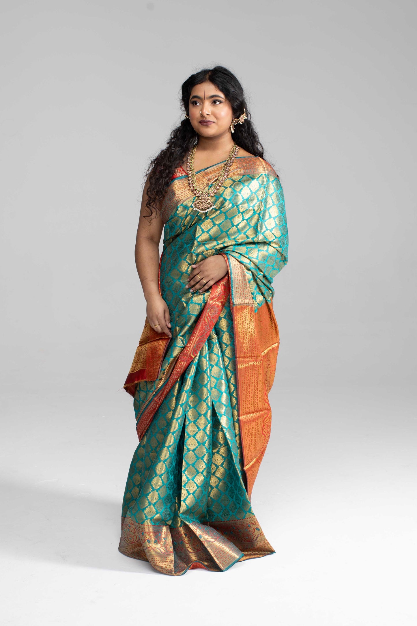 Green and gold saree with Red border