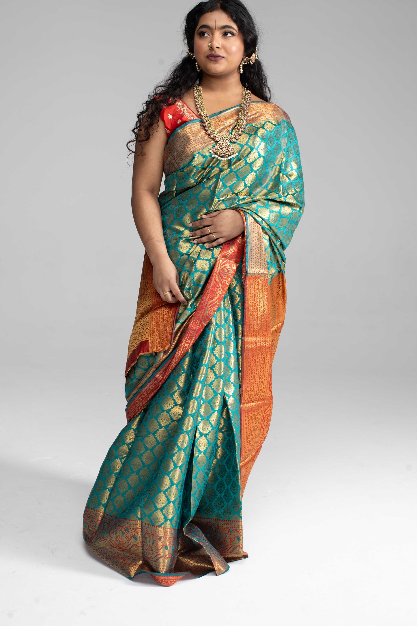 Green and gold saree with Red border