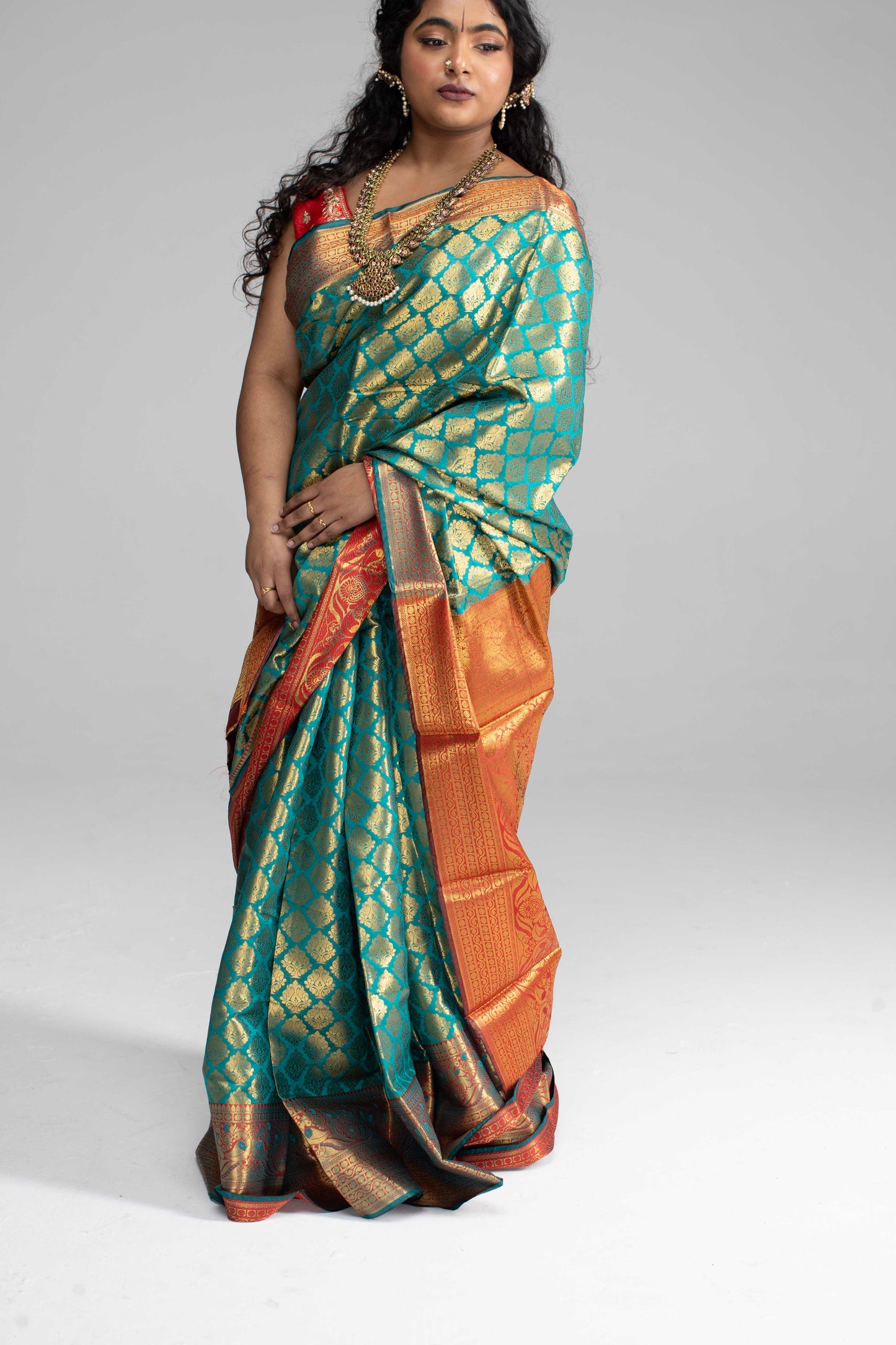 Green and gold saree with Red border