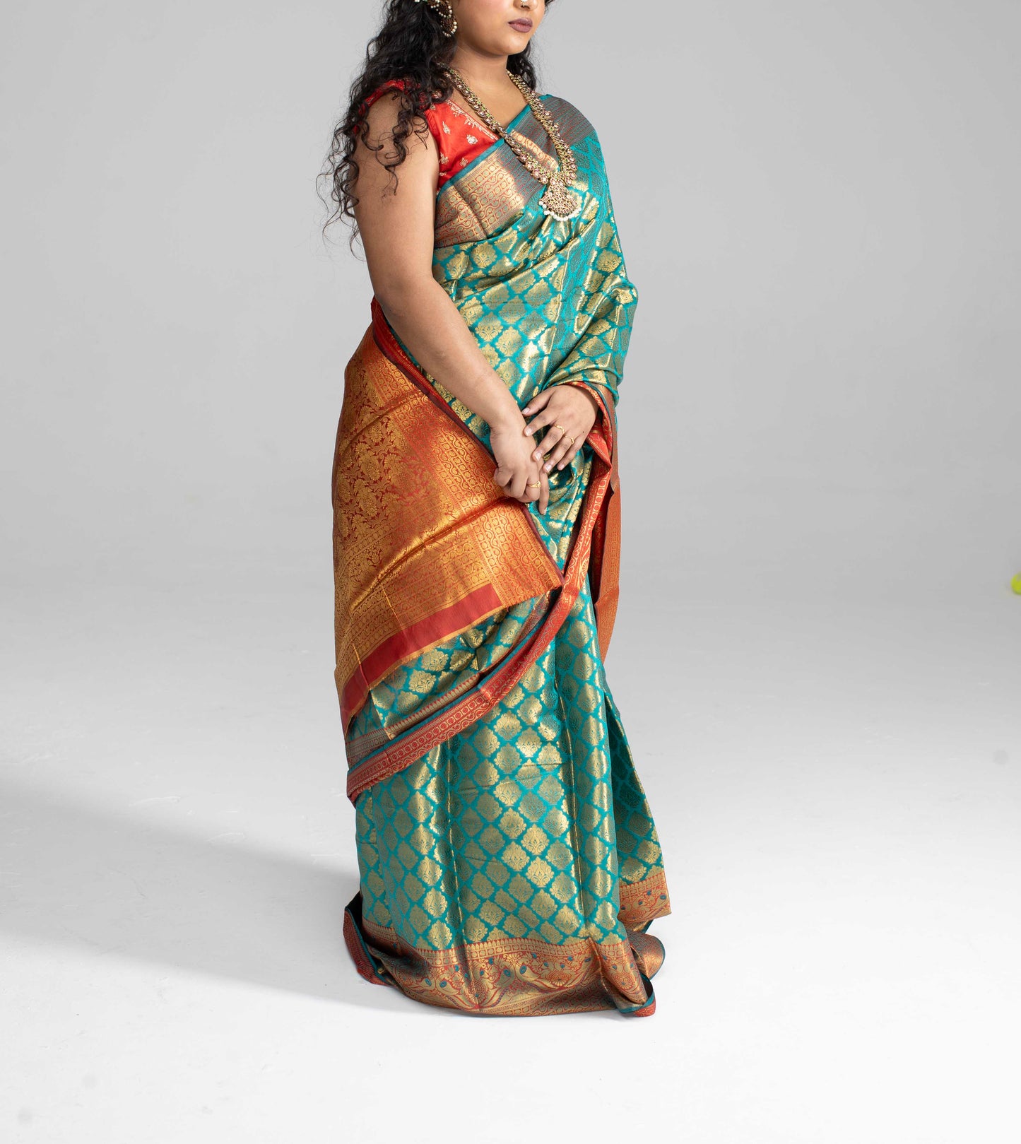 Green and gold saree with Red border