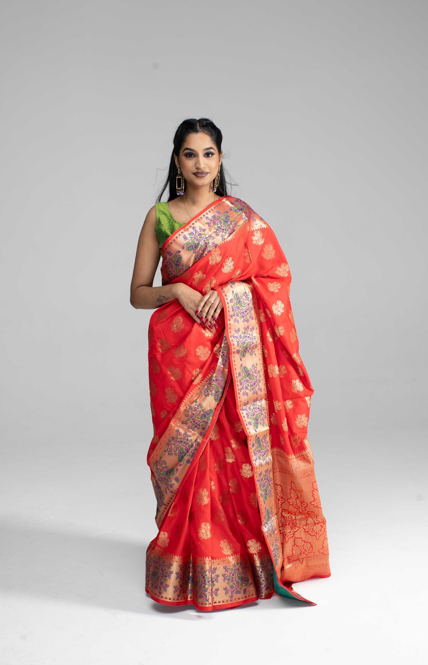 Red silk saree with large gold border