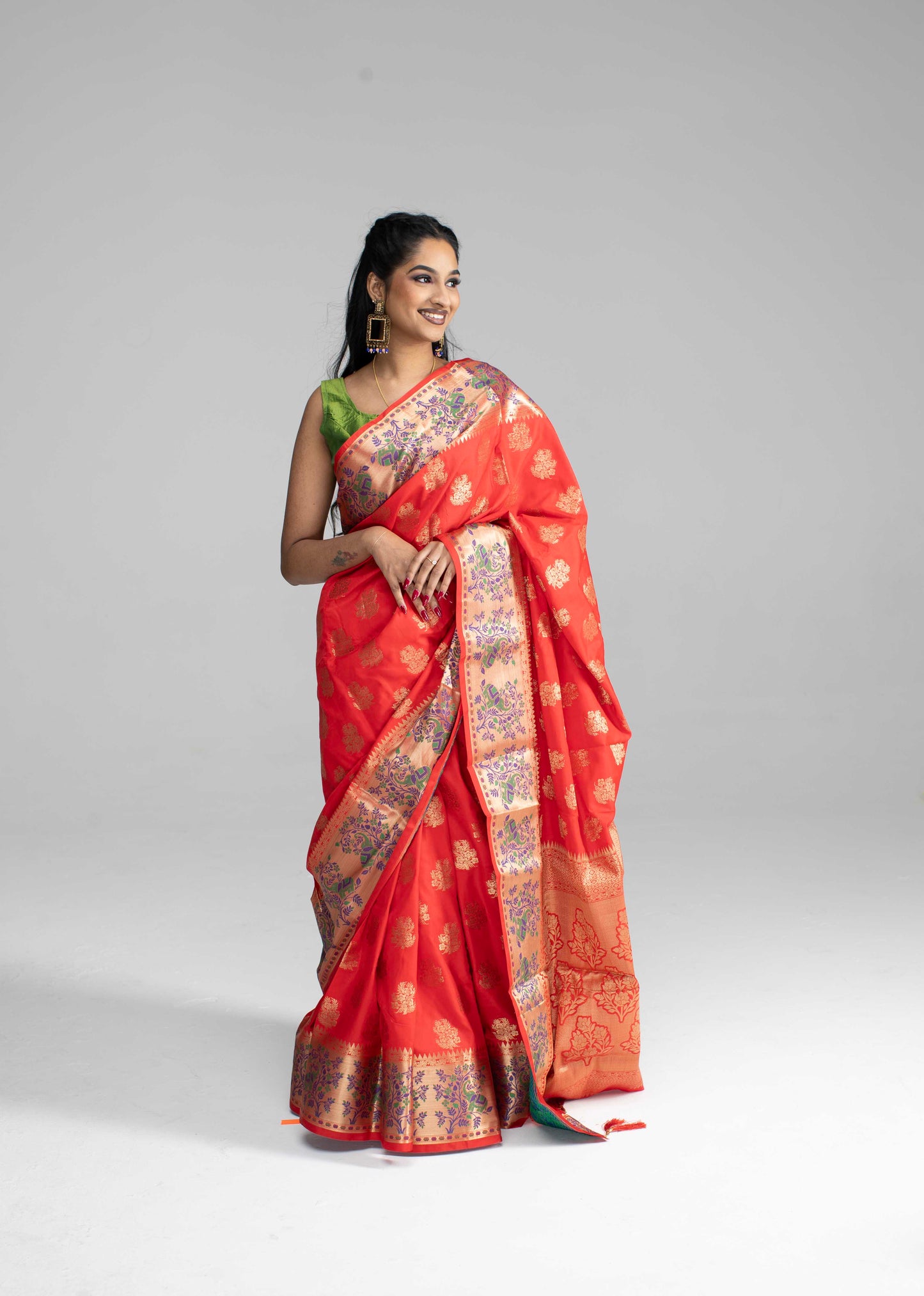 Red silk saree with large gold border