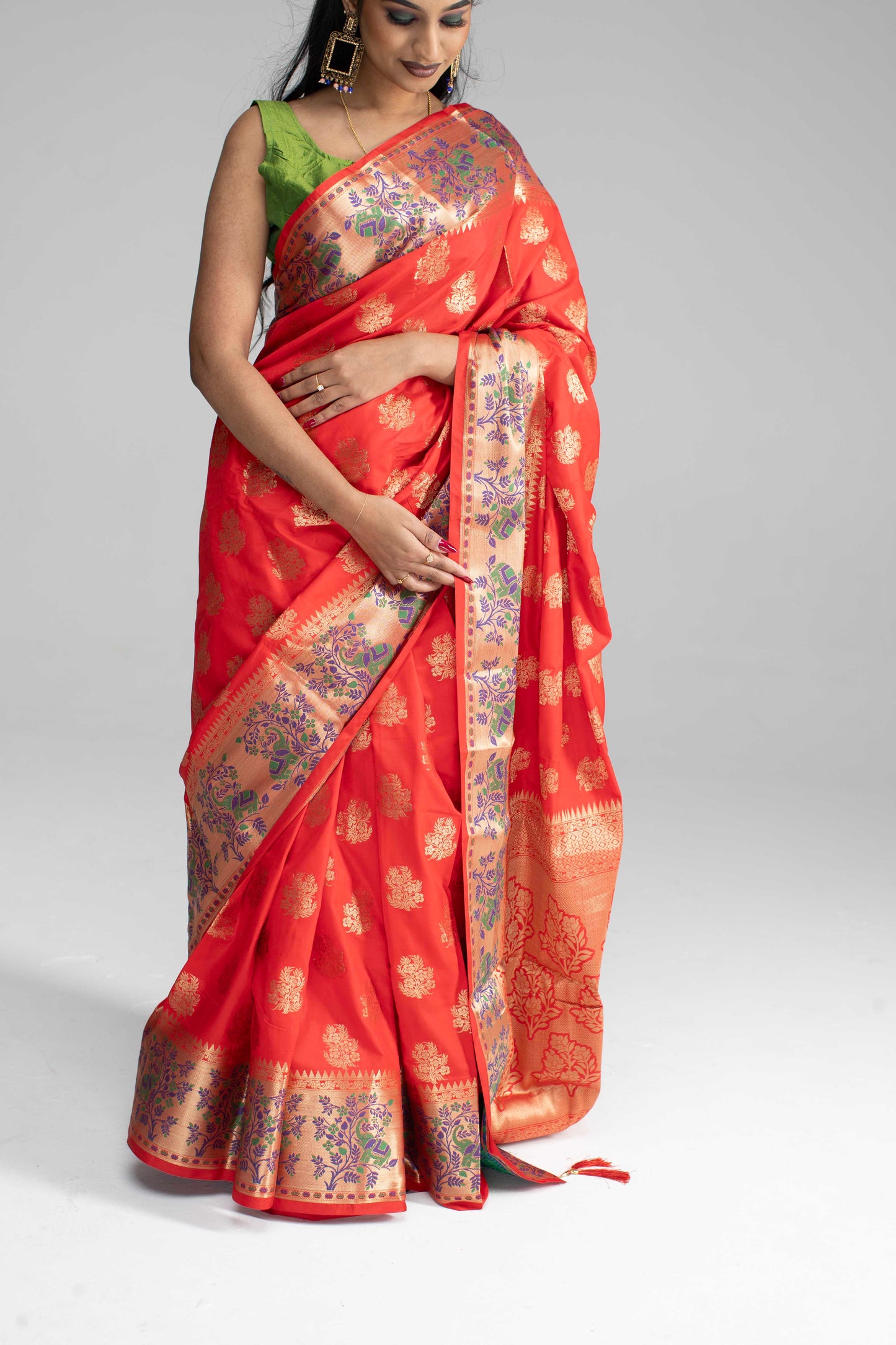 Red silk saree with large gold border