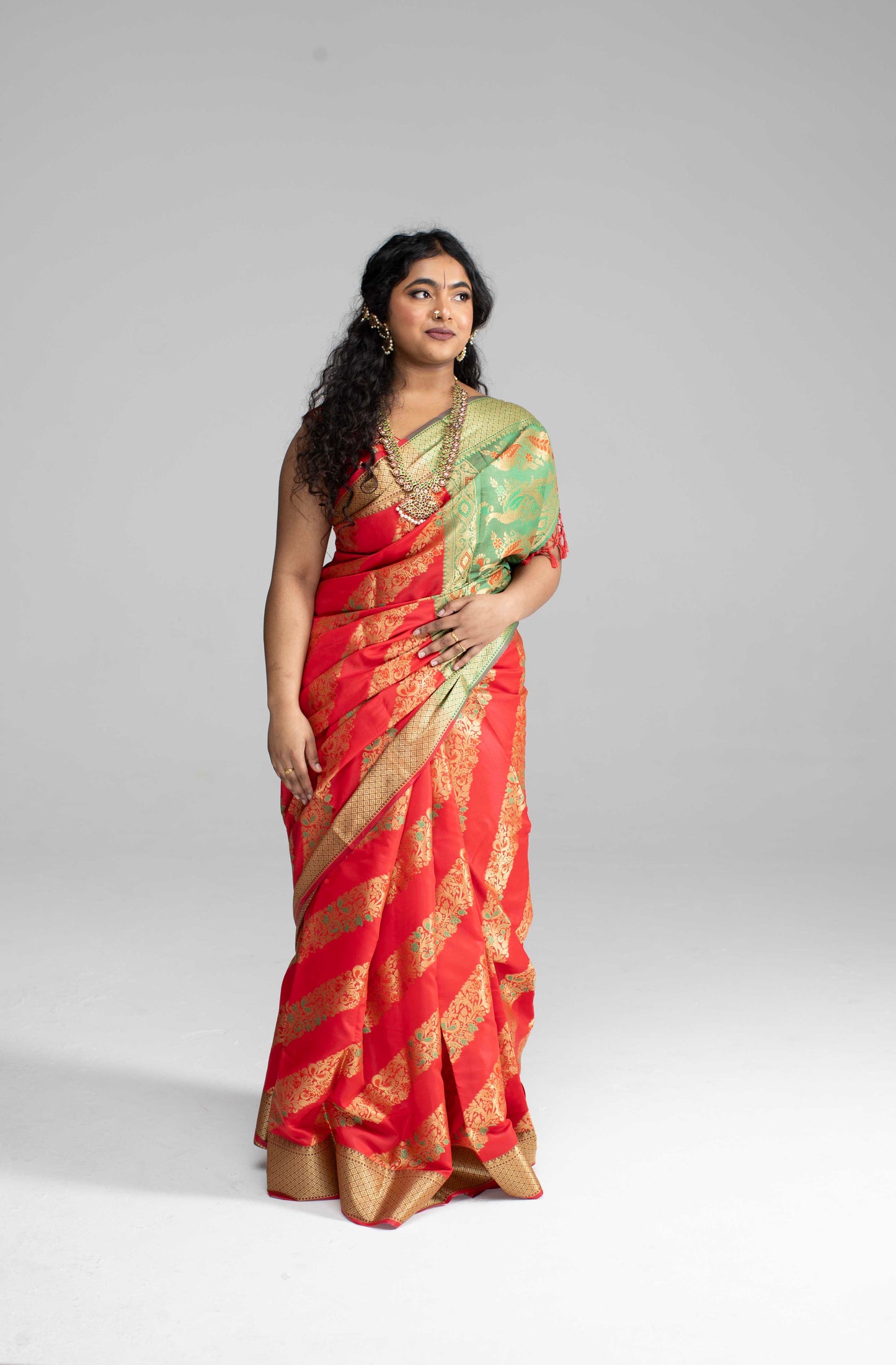 Red silk saree with diagonal gold Zari work