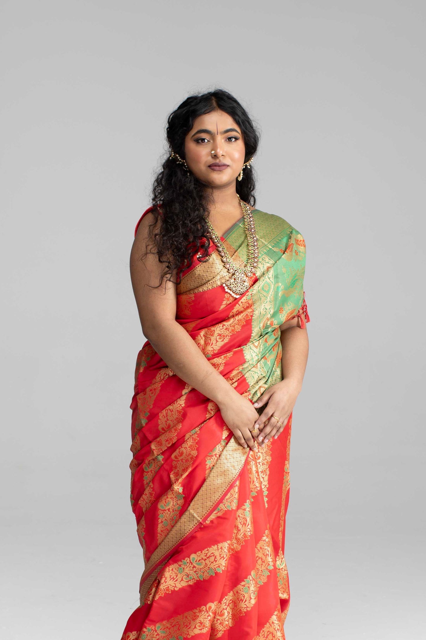Red silk saree with diagonal gold Zari work
