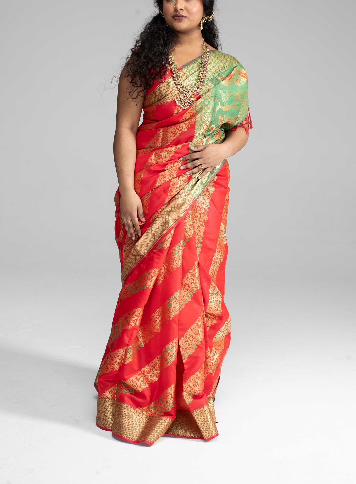 Red silk saree with diagonal gold Zari work