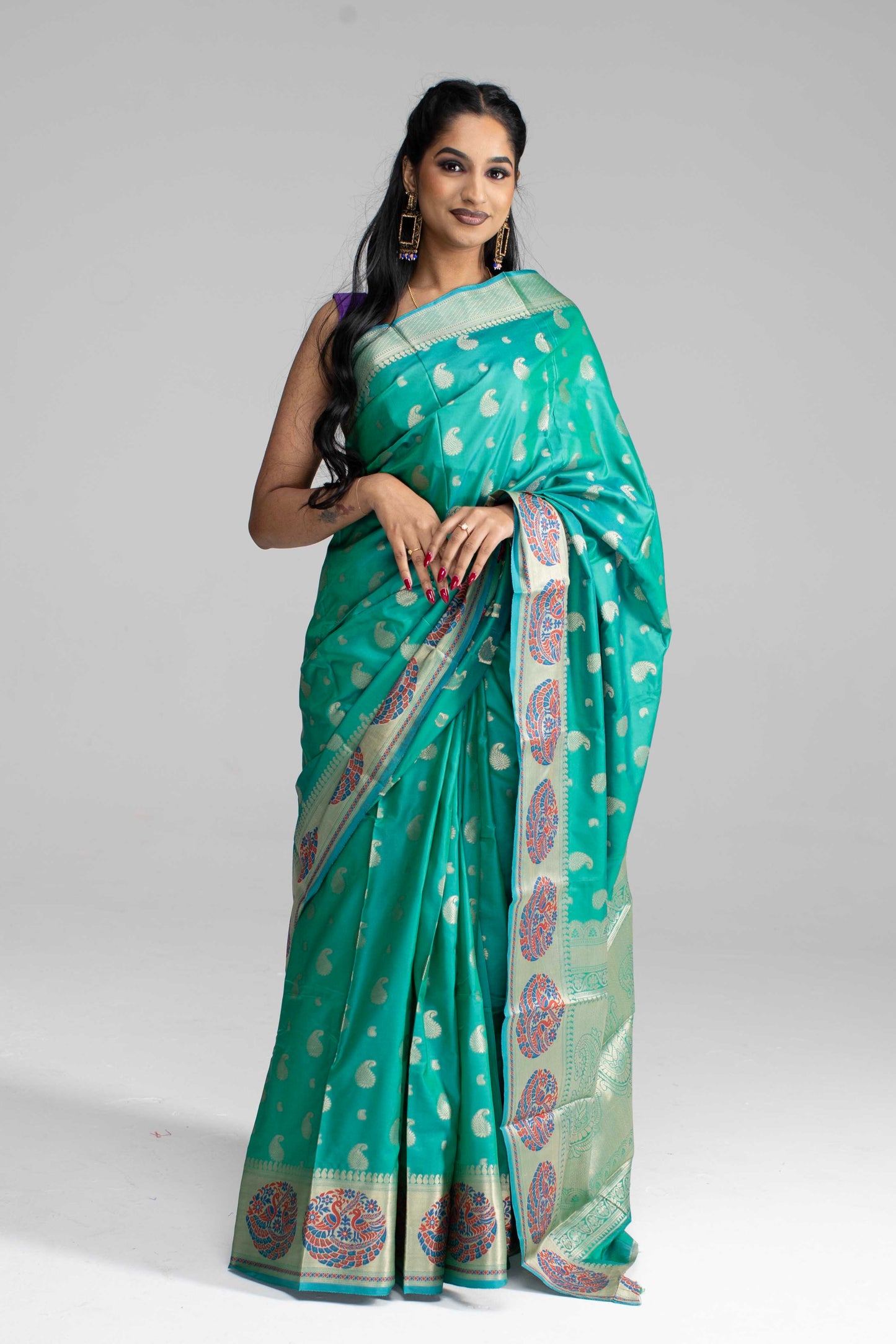 Teal Green Silk Saree with Peacock Motif Border