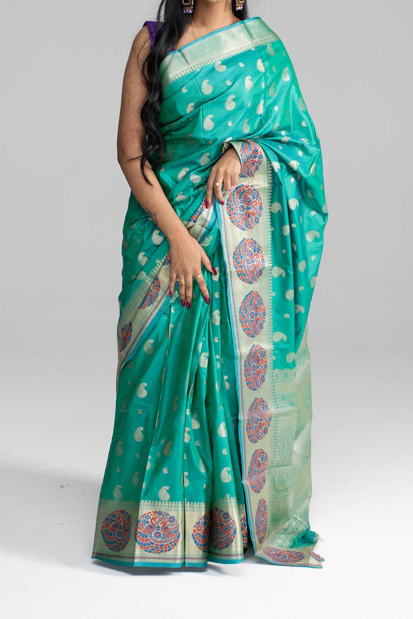Teal Green Silk Saree with Peacock Motif Border