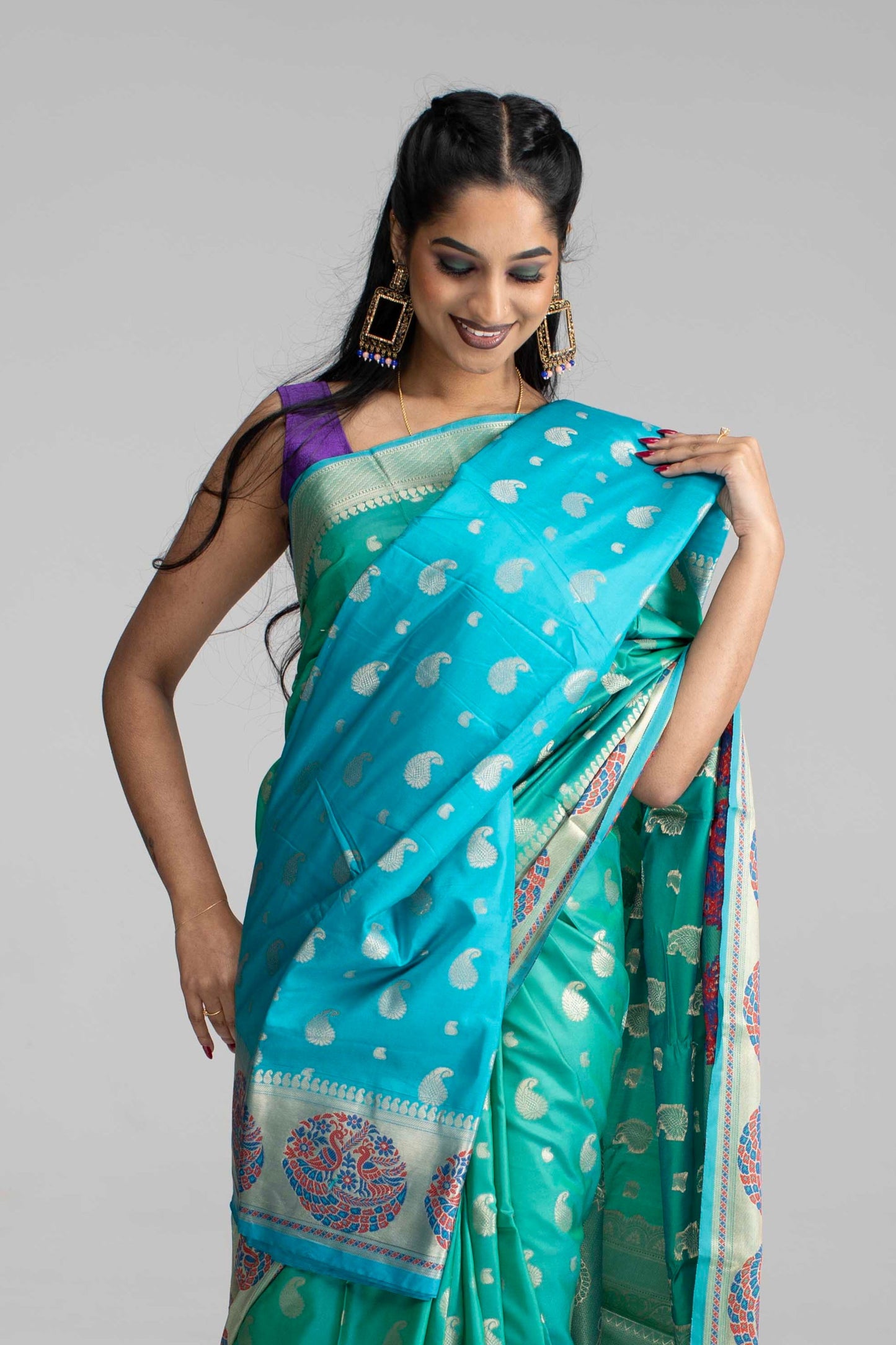 Teal Green Silk Saree with Peacock Motif Border
