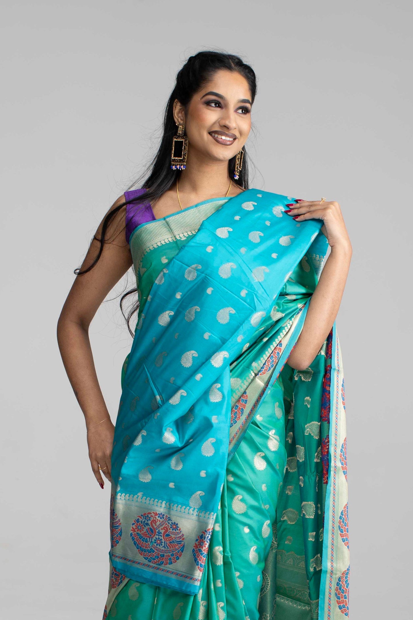 Teal Green Silk Saree with Peacock Motif Border