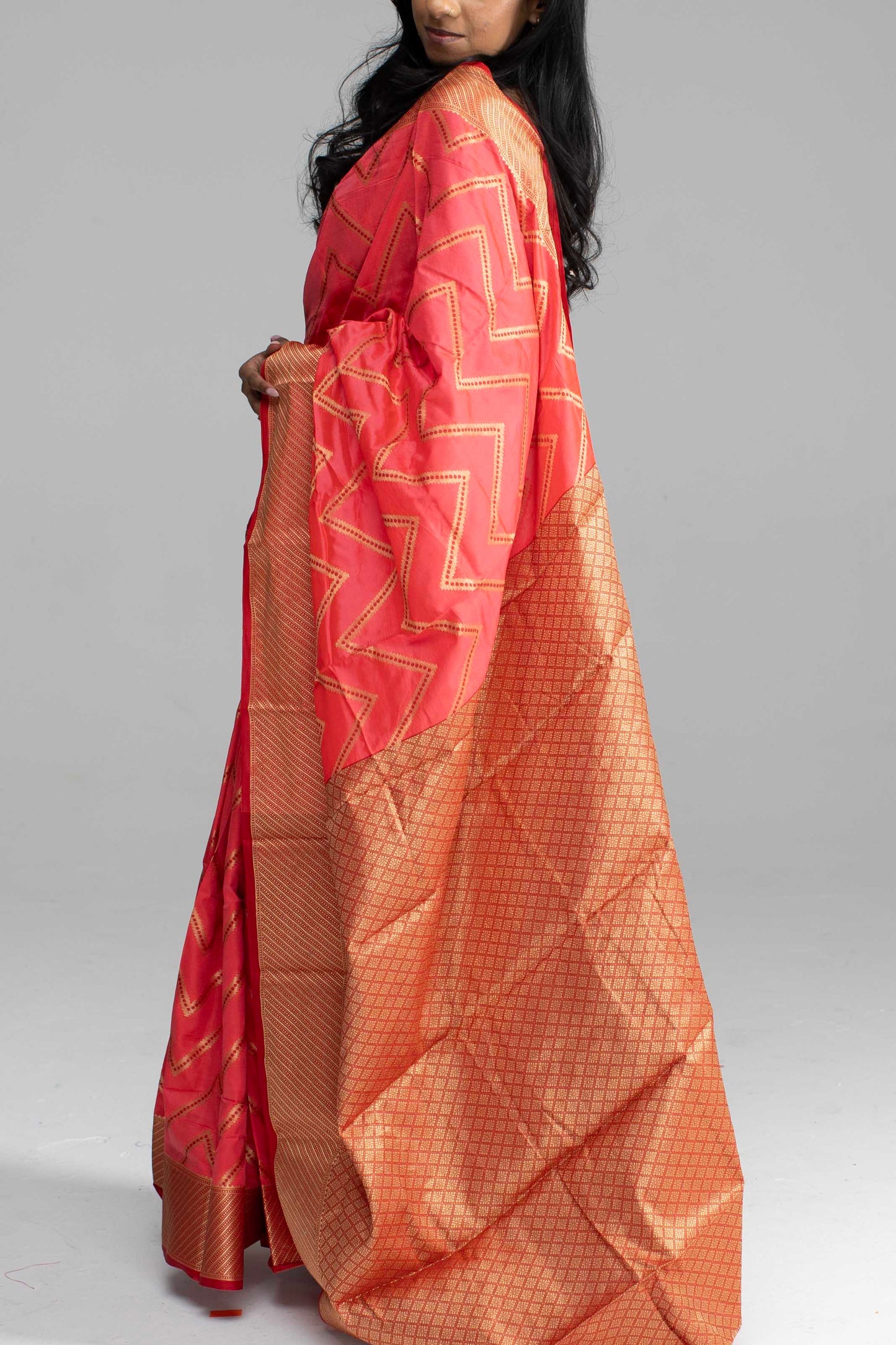 Vibrant Peach Silk Saree with Golden Zari Chevron Design