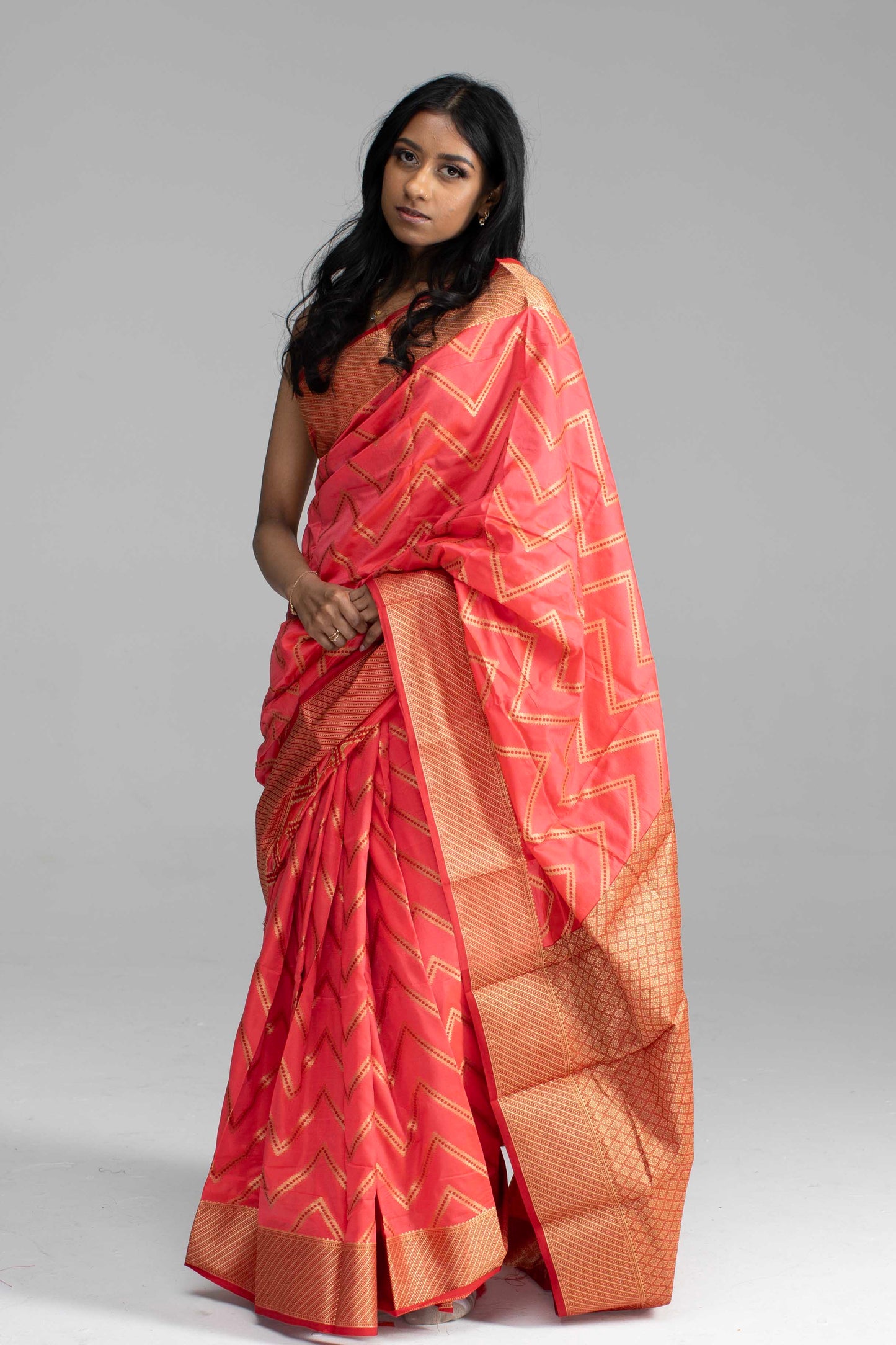 Vibrant Peach Silk Saree with Golden Zari Chevron Design