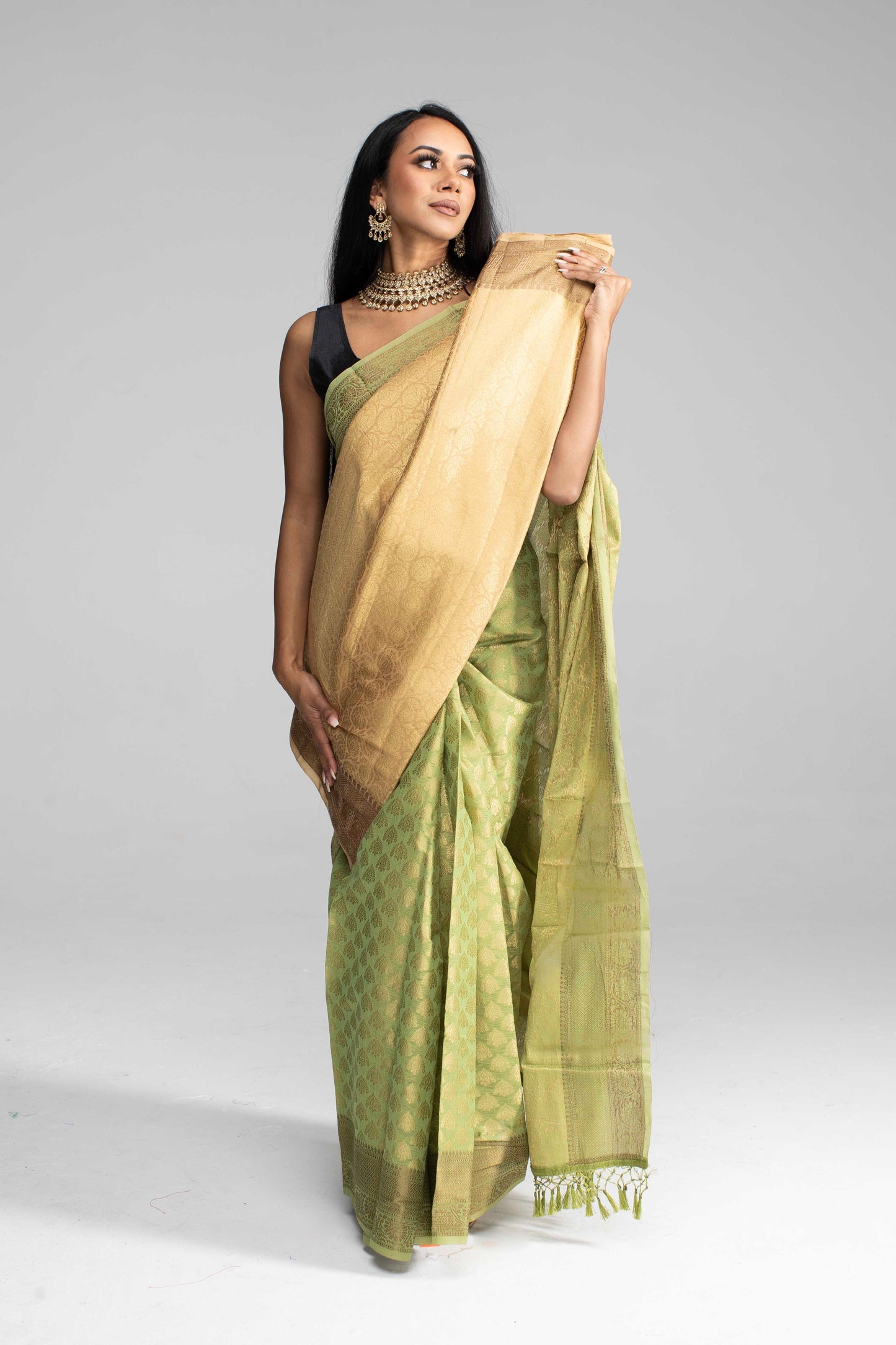 Olive Green Silk Saree Adorned in All-Over Gold Work