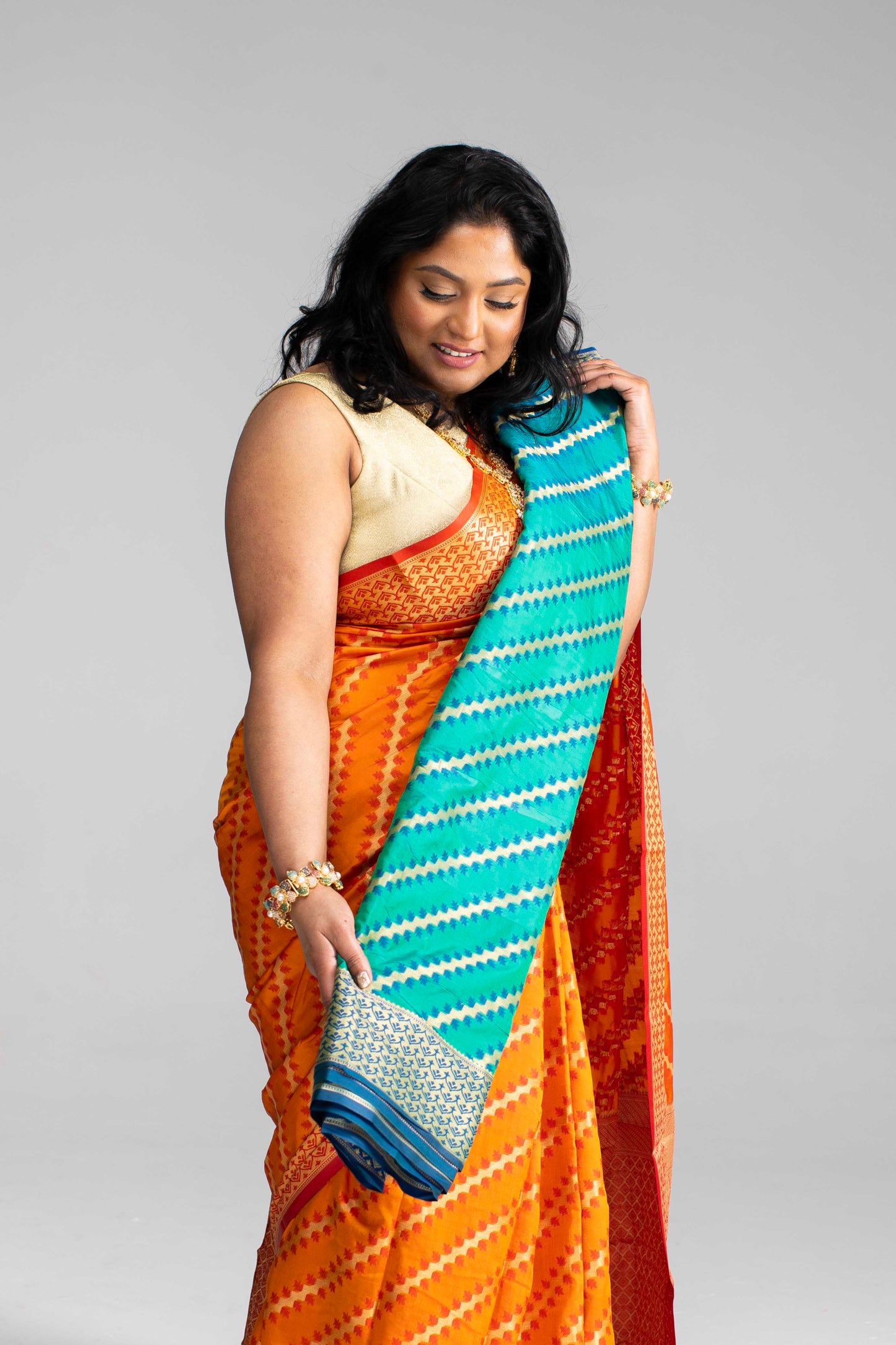 Radiant Orange Silk Saree with Gold Lines
