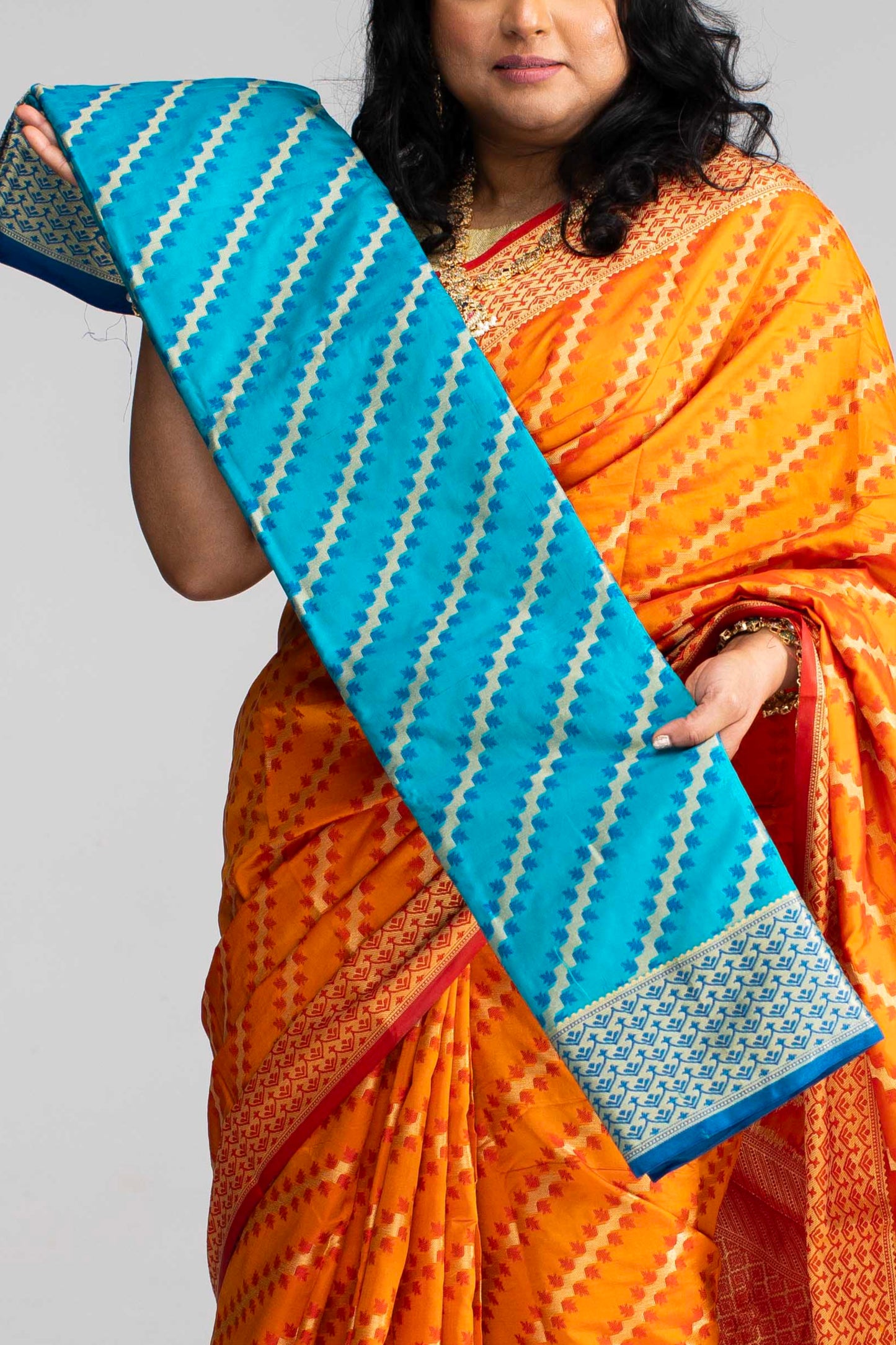 Radiant Orange Silk Saree with Gold Lines