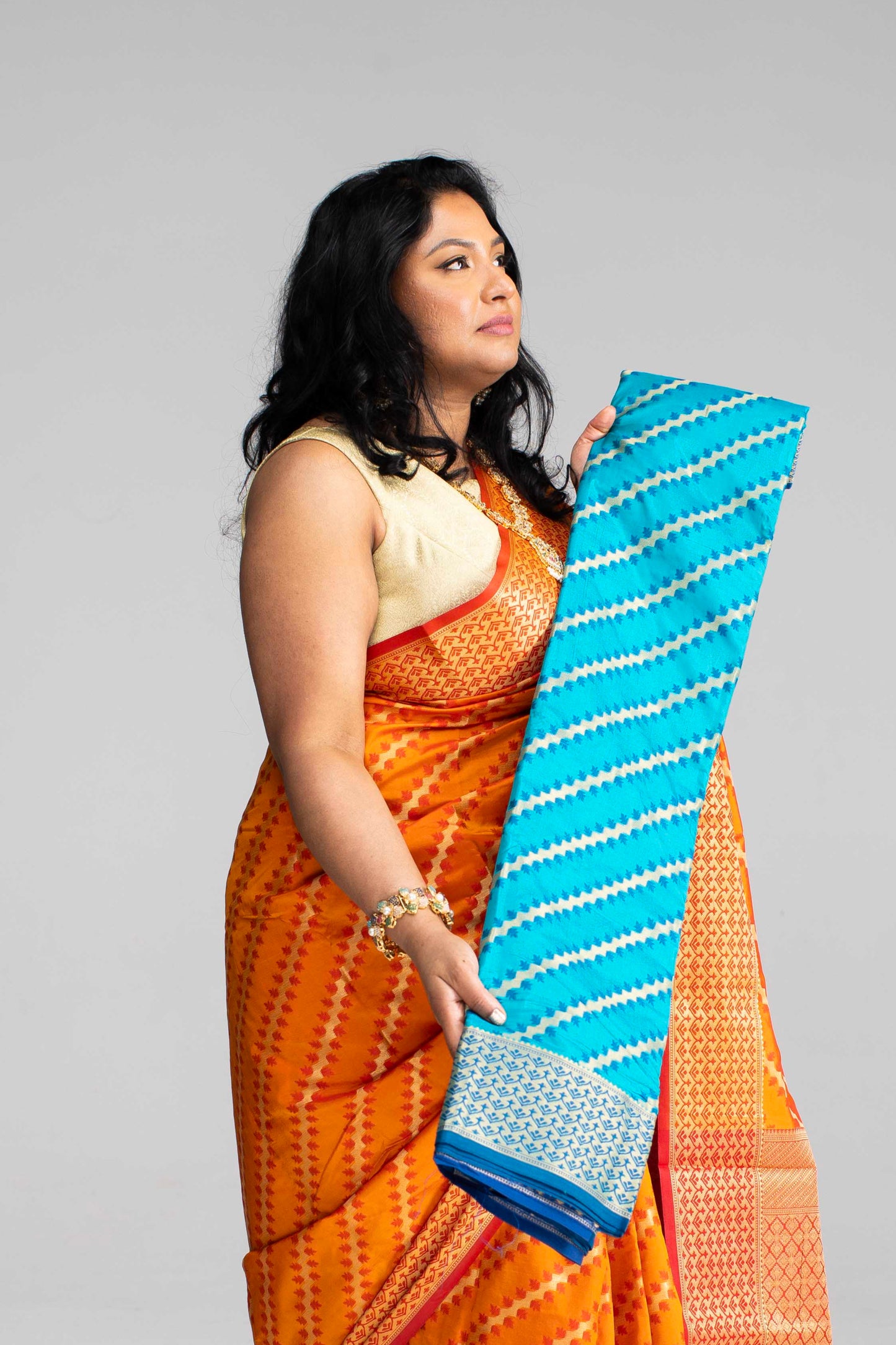 Radiant Orange Silk Saree with Gold Lines