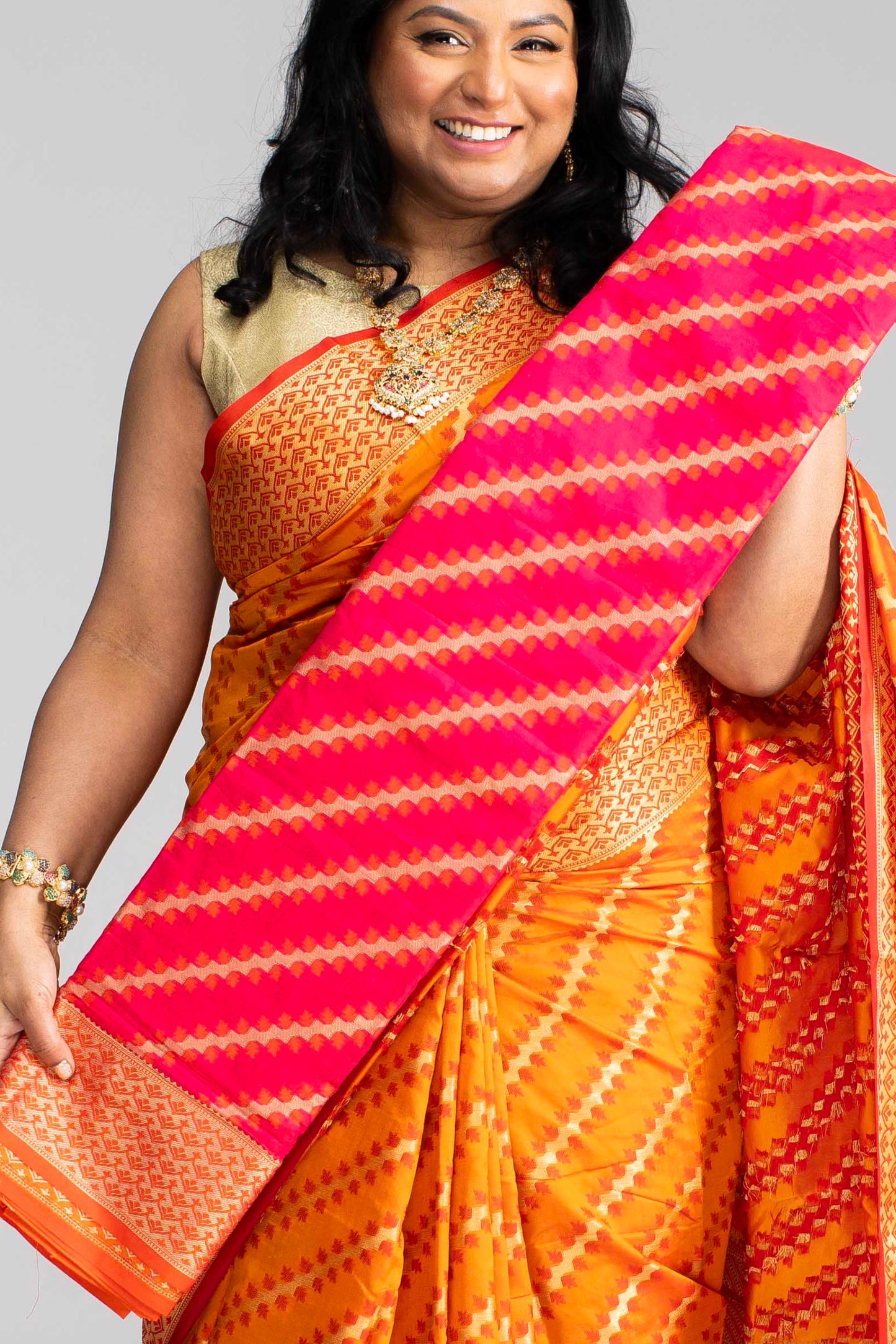 Radiant Orange Silk Saree with Gold Lines