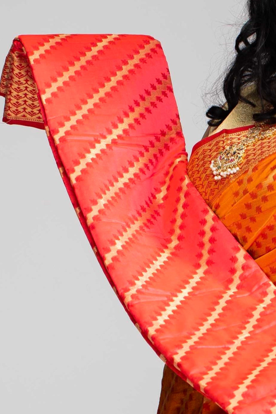 Radiant Orange Silk Saree with Gold Lines