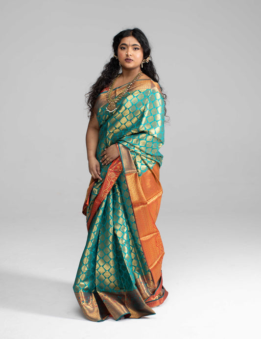 Green and gold saree with Red border