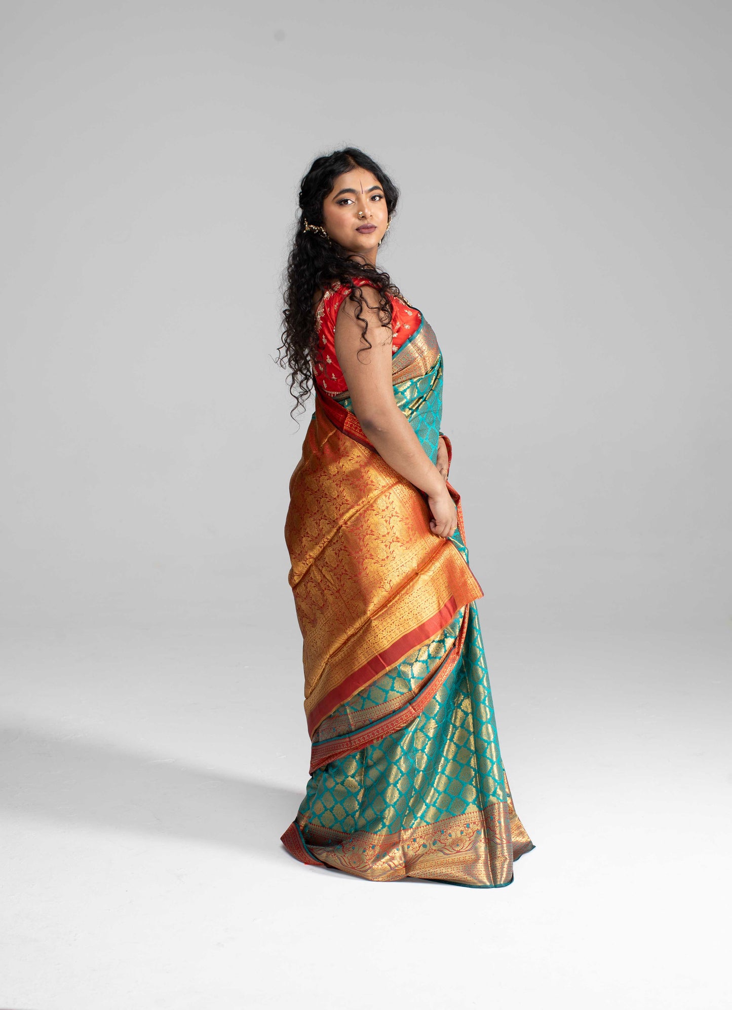Green and gold saree with Red border