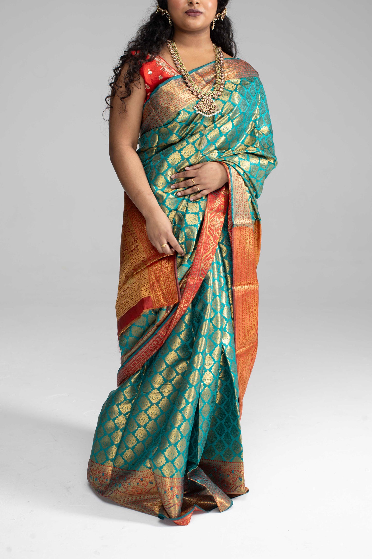 Green and gold saree with Red border