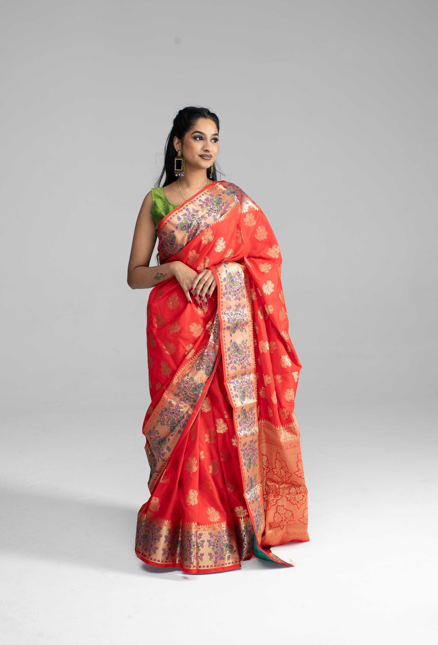 Red silk saree with large gold border