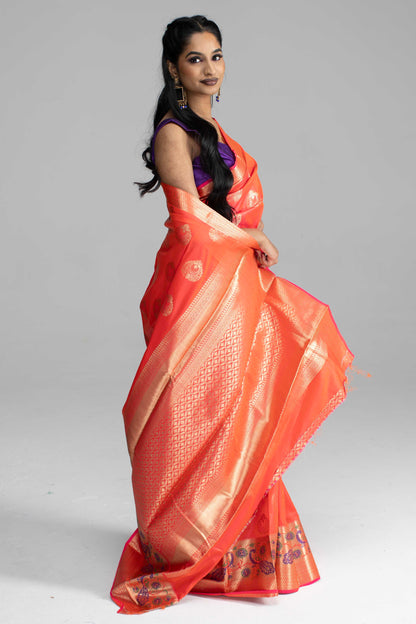 Dual-Shade Peach Saree with Broad Zari Border & Purple Peacock Motif