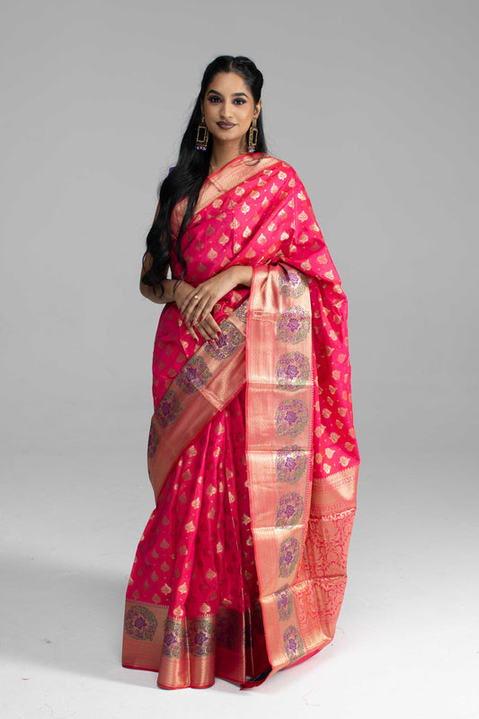 Radiant Pink Silk Saree with Golden Zari Weaving & Floral Motifs