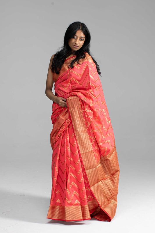 Vibrant Peach Silk Saree with Golden Zari Chevron Design