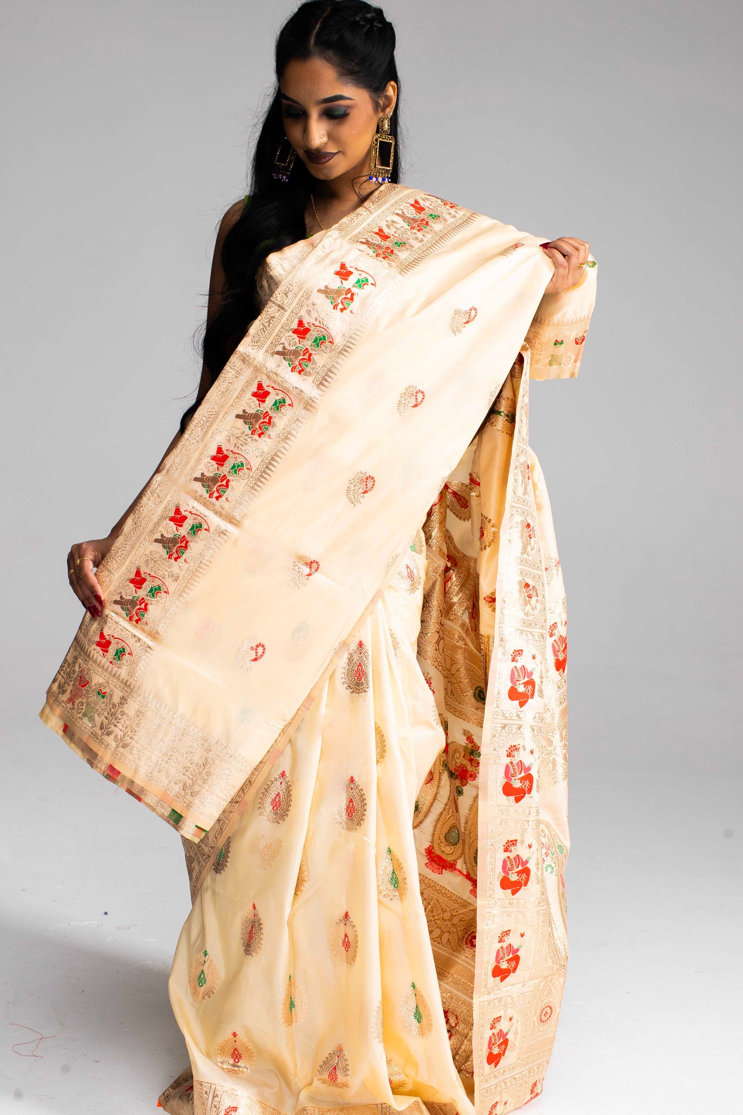 Graceful Cream Silk Saree with Gold Motif Work