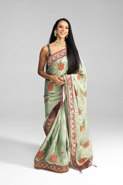 Luxurious Olive Green saree with Floral Embroidery and Contrast Border