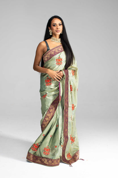 Luxurious Olive Green saree with Floral Embroidery and Contrast Border