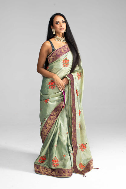 Luxurious Olive Green saree with Floral Embroidery and Contrast Border