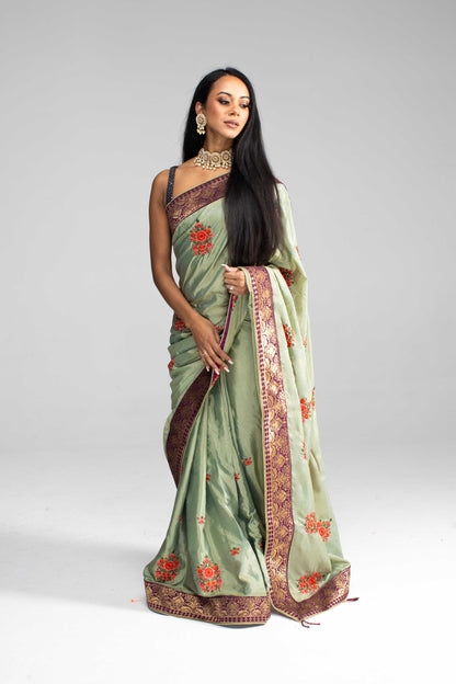 Luxurious Olive Green saree with Floral Embroidery and Contrast Border