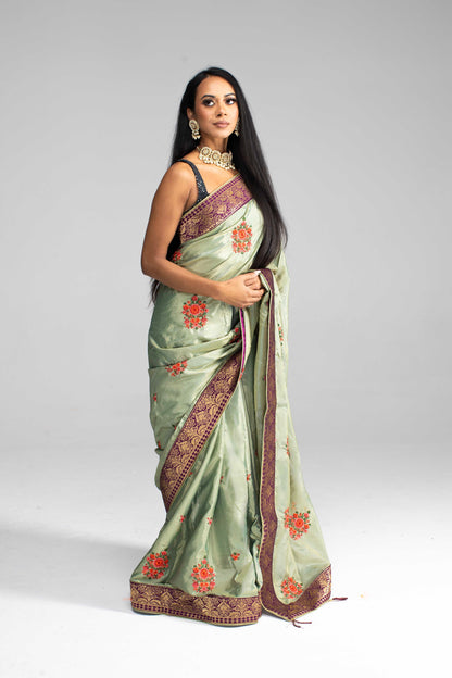 Luxurious Olive Green saree with Floral Embroidery and Contrast Border