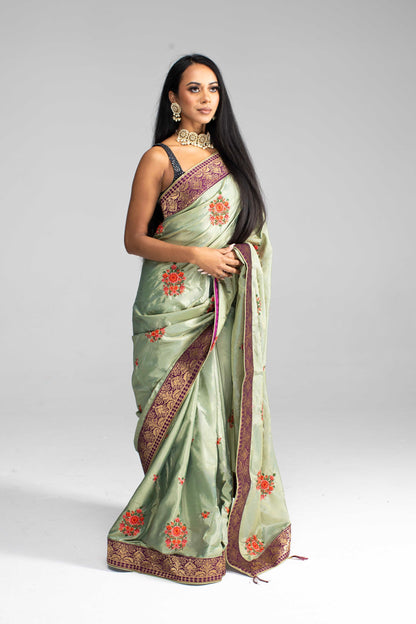 Luxurious Olive Green saree with Floral Embroidery and Contrast Border