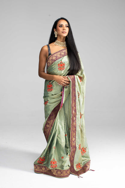 Luxurious Olive Green saree with Floral Embroidery and Contrast Border