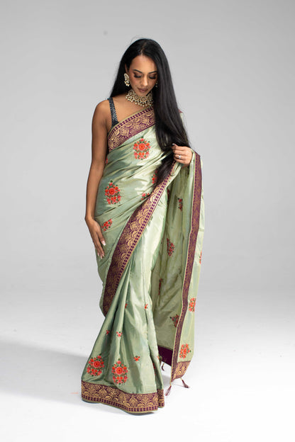 Luxurious Olive Green saree with Floral Embroidery and Contrast Border