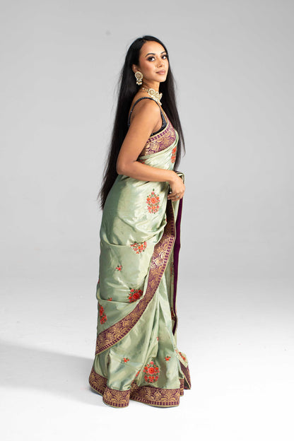 Luxurious Olive Green saree with Floral Embroidery and Contrast Border