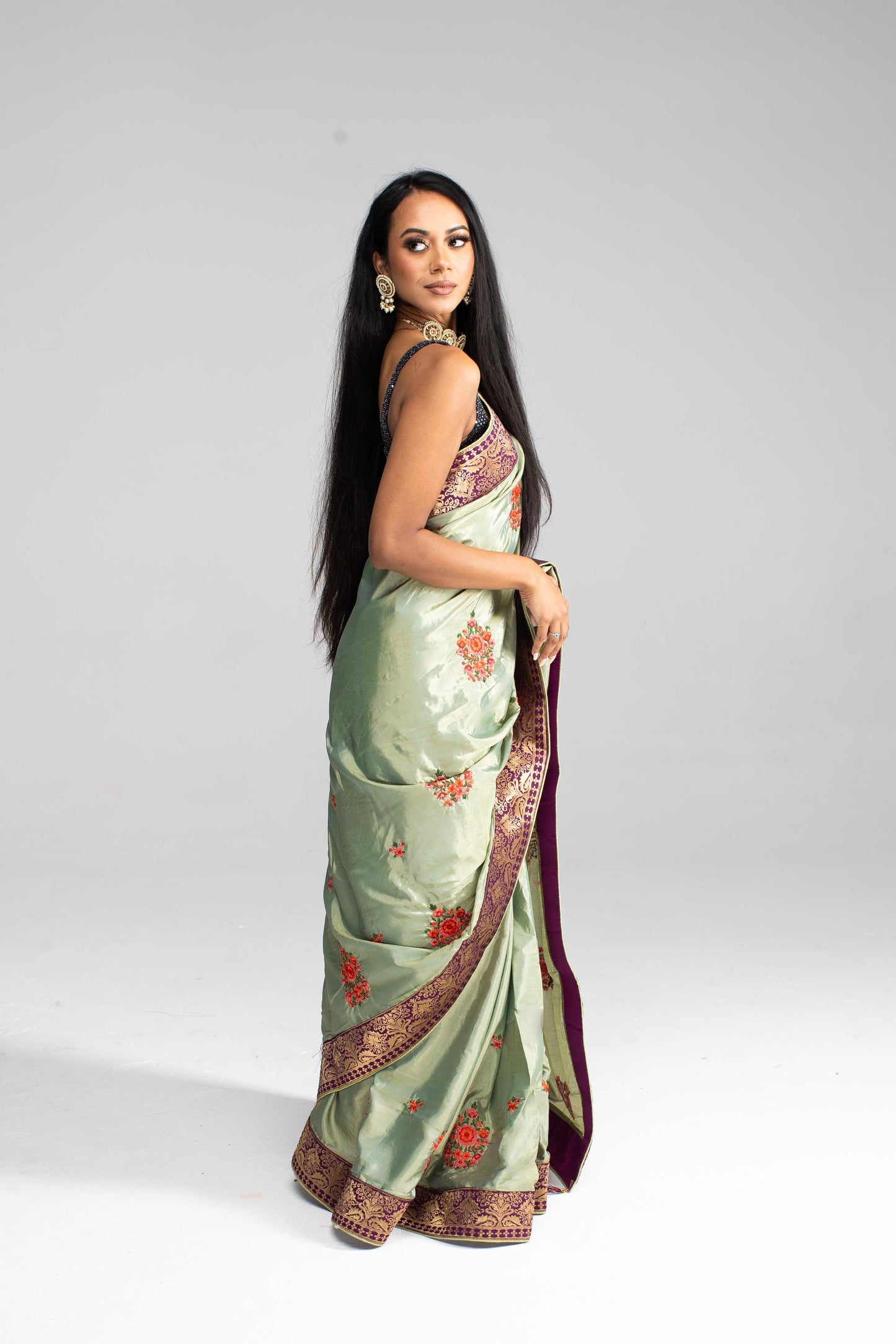 Luxurious Olive Green saree with Floral Embroidery and Contrast Border