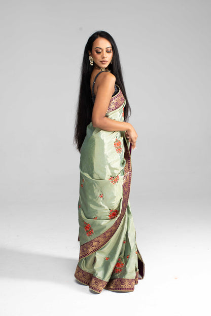 Luxurious Olive Green saree with Floral Embroidery and Contrast Border