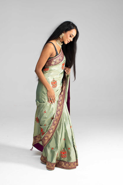 Luxurious Olive Green saree with Floral Embroidery and Contrast Border